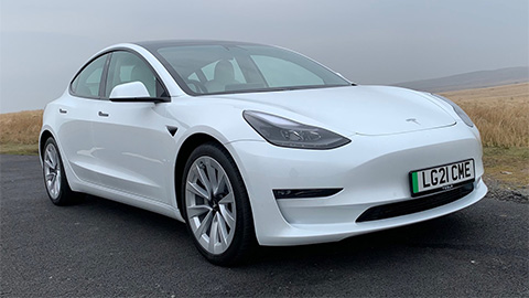 White Tesla Model 3, parked