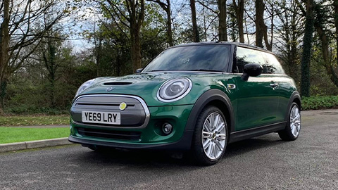 Green MINI Electric, parked