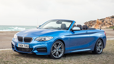 Blue BMW 2 Series convertible, parked