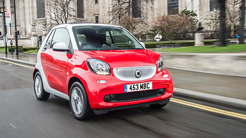 Red smart fortwo cabrio, driving
