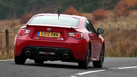 Red Toyota GT86, rear, driving