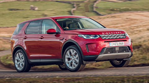 Red Land Rover Discovery Sport, driving