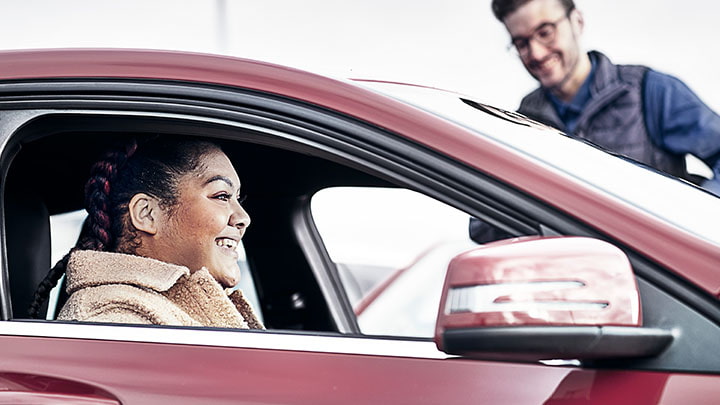 Female Customer with Advisor in Car
