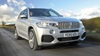Silver BMW X5 Exterior Front Driving