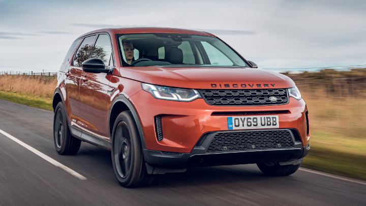 Orange Land Rover Discovery Sport Exterior Front Driving