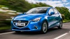 Blue Mazda 2 Exterior Front Driving